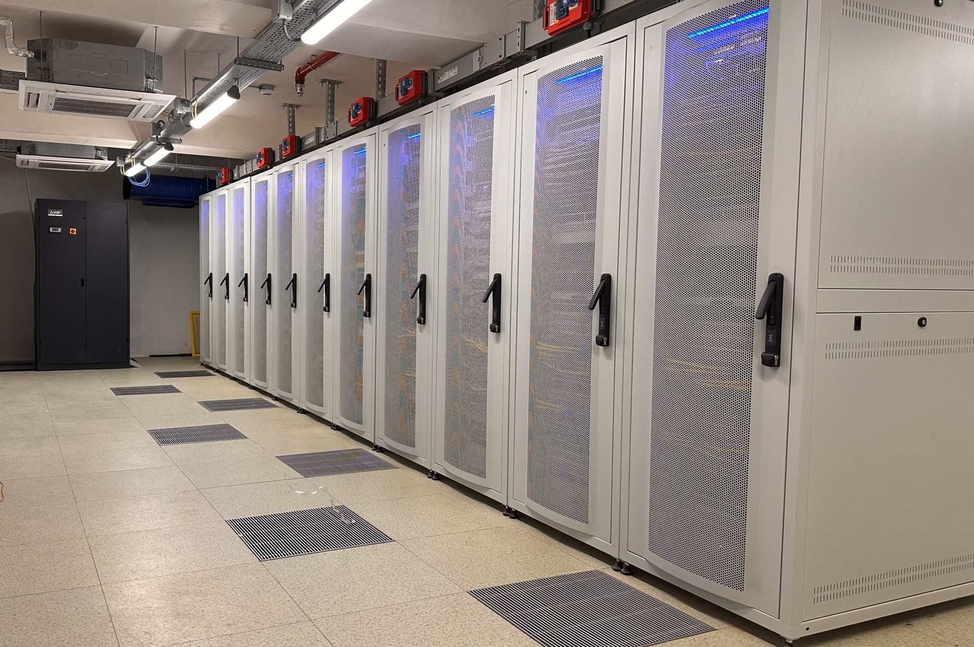 Organized server racks and data cabinets in an airport data center